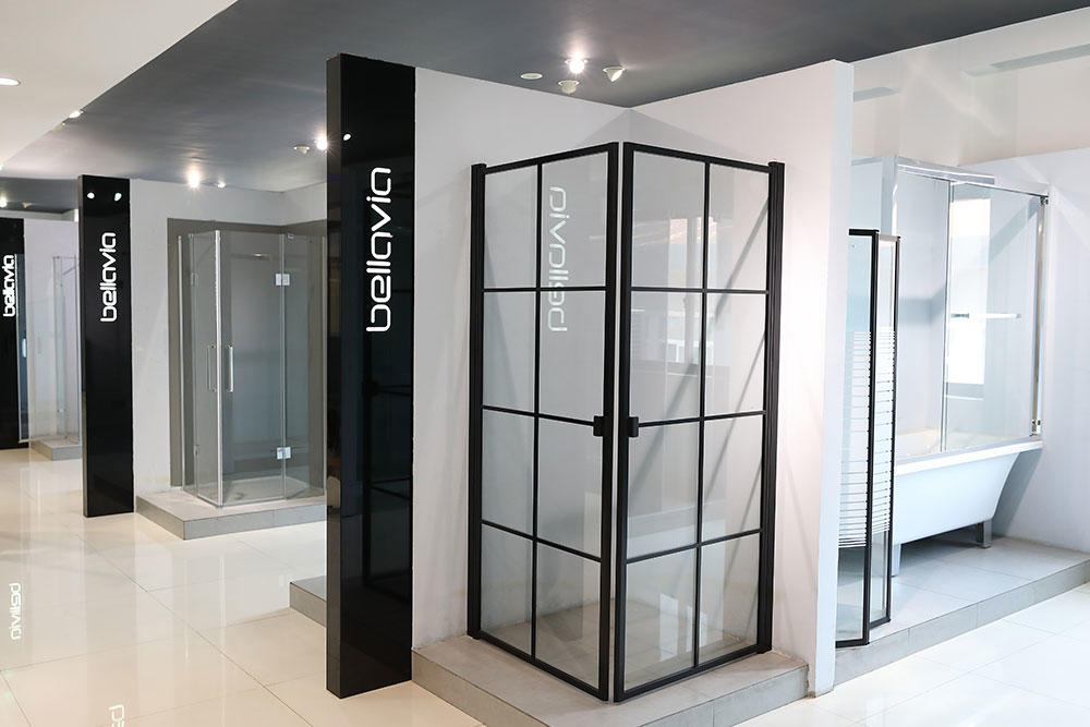 What are the different types of glass options available for shower enclosures?